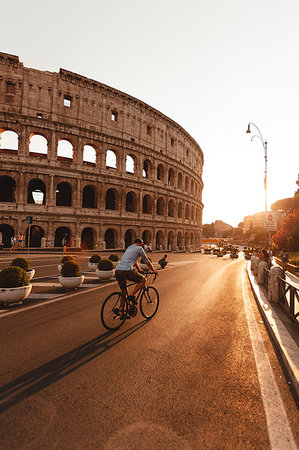 sunset colosseum - Man riding bicycle by Colosseum Stock Photo - Premium Royalty-Free, Code: 632-09273091