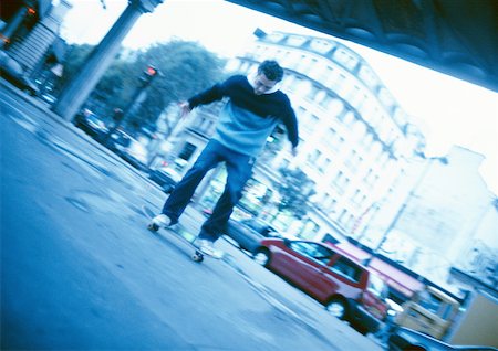 skating in the street - Young man skateboarding in street Stock Photo - Premium Royalty-Free, Code: 632-01137031