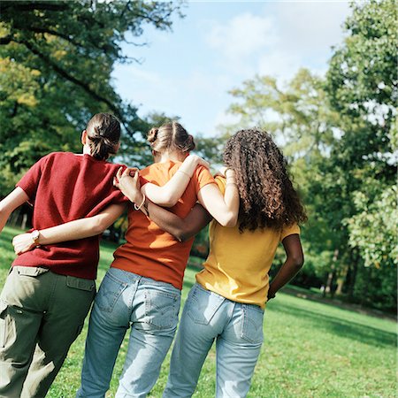 simsearch:695-03382482,k - Three young women walking on grass with arms around each other, rear view Stock Photo - Premium Royalty-Free, Code: 632-01137593