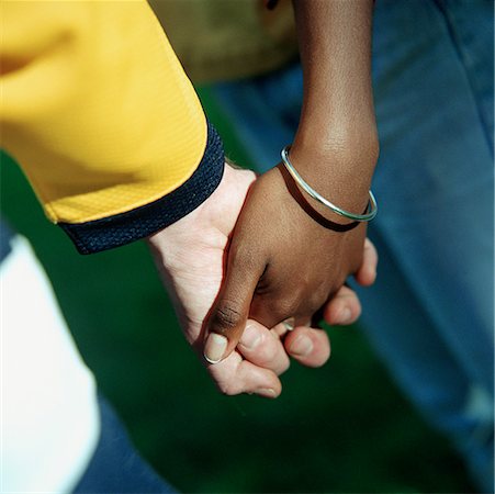 simsearch:695-03382482,k - Young man's and woman's clasped hands, close up. Stock Photo - Premium Royalty-Free, Code: 632-01137624
