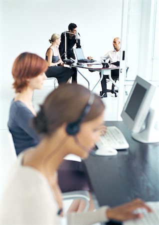 Business people in office, blurred foreground Stock Photo - Premium Royalty-Free, Code: 632-01146012