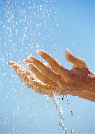 simsearch:632-05816631,k - Hands under drops of water, close up Stock Photo - Premium Royalty-Free, Code: 632-01146602