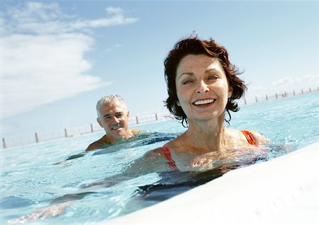 Mature man and woman in swimming pool, portrait Stock Photo - Premium Royalty-Free, Code: 632-01146634