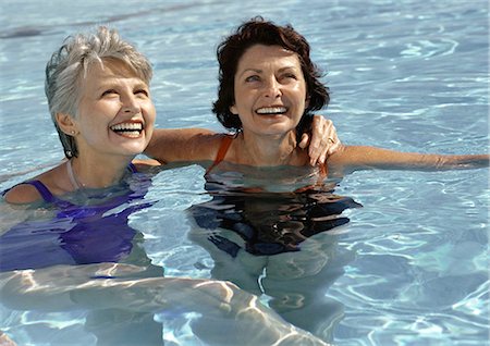 senior women swimming - Two mature women in swimming pool, smiling Stock Photo - Premium Royalty-Free, Code: 632-01146650