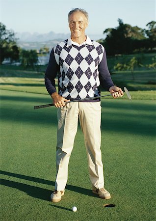 retired rich old man - Mature man holding golf club next to hole, portrait Stock Photo - Premium Royalty-Free, Code: 632-01146669