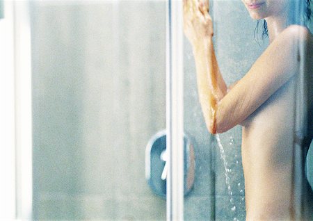 Woman in shower, partial view Stock Photo - Premium Royalty-Free, Code: 632-01148799