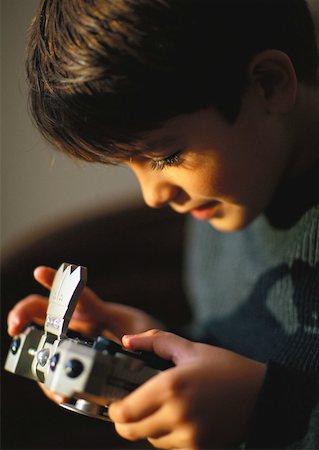 simsearch:632-03424261,k - Young boy playing with video game Stock Photo - Premium Royalty-Free, Code: 632-01149477