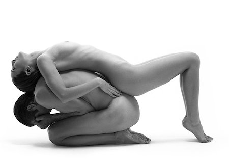Nude man in fetal position, nude woman lying across man's back, side view, b&w Stock Photo - Premium Royalty-Free, Code: 632-01142528