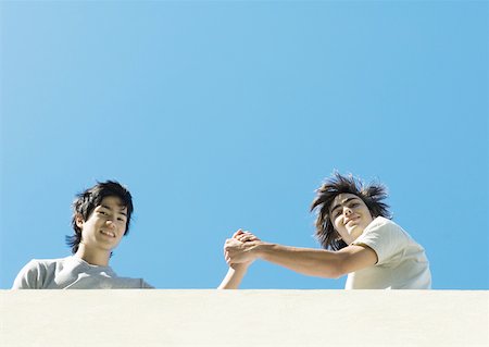 simsearch:695-03382482,k - Two young male friends, low angle view Stock Photo - Premium Royalty-Free, Code: 632-01155056