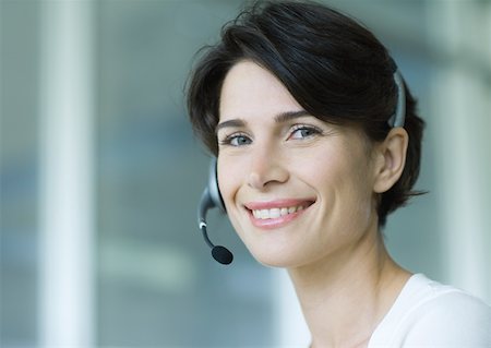 switchboard operator - Woman wearing headset and smiling Stock Photo - Premium Royalty-Free, Code: 632-01155788