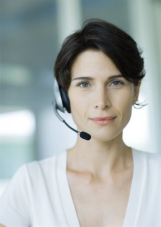 switchboard operator - Woman wearing headset and smiling Stock Photo - Premium Royalty-Free, Code: 632-01155833