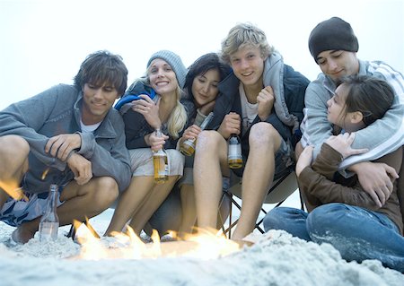 simsearch:695-03382482,k - Group of young adult friends sitting around campfire Stock Photo - Premium Royalty-Free, Code: 632-01156621