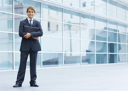 simsearch:632-05401320,k - Businessman holding briefcase, full length portrait Stock Photo - Premium Royalty-Free, Code: 632-01157391