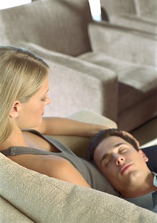 simsearch:693-03707745,k - Man sleeping with head on woman's lap Stock Photo - Premium Royalty-Free, Code: 632-01158639