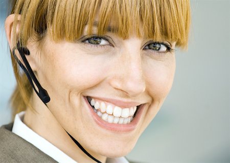 switchboard operator - Woman wearing headset, smiling Stock Photo - Premium Royalty-Free, Code: 632-01159282