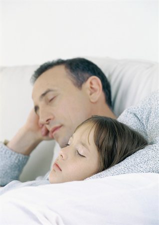Father and daughter sitting on sofa, sleeping Stock Photo - Premium Royalty-Free, Code: 632-01151555