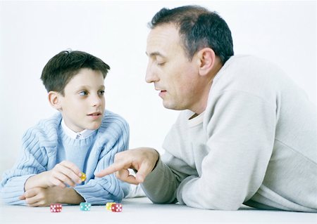 simsearch:632-03027302,k - Father and son playing dice on floor Stock Photo - Premium Royalty-Free, Code: 632-01151564