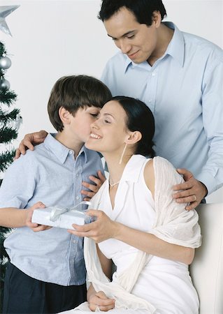 simsearch:632-05816381,k - Boy giving gift to mother, father standing behind them Stock Photo - Premium Royalty-Free, Code: 632-01151584