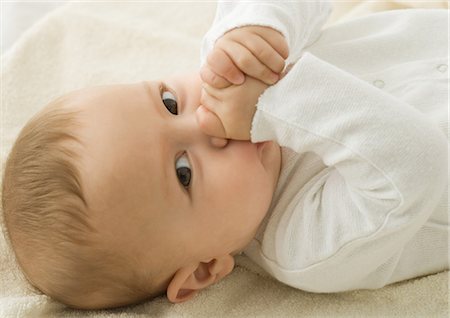 Baby sucking thumb, portrait Stock Photo - Premium Royalty-Free, Code: 632-01153313