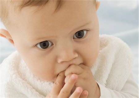 simsearch:632-03027302,k - Baby putting fingers in mouth, close-up Stock Photo - Premium Royalty-Free, Code: 632-01153325