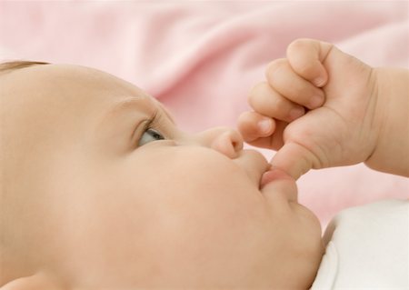 Baby sucking thumb, close-up Stock Photo - Premium Royalty-Free, Code: 632-01153322