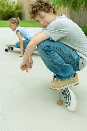 Kids playing on skateboards Stock Photo - Premium Royalty-Free, Code: 632-01161878