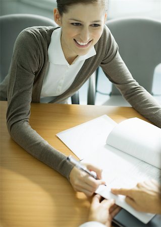 Woman signing contract Stock Photo - Premium Royalty-Free, Code: 632-01194134