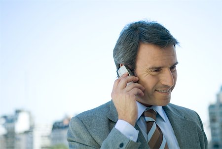 simsearch:695-03376228,k - Businessman using cell phone Stock Photo - Premium Royalty-Free, Code: 632-01271182