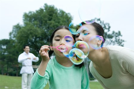simsearch:632-05604245,k - Girl and mother blowing bubbles Stock Photo - Premium Royalty-Free, Code: 632-01271293