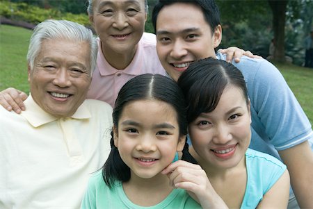 simsearch:6116-06939008,k - Three generation family in park, portrait Stock Photo - Premium Royalty-Free, Code: 632-01271351