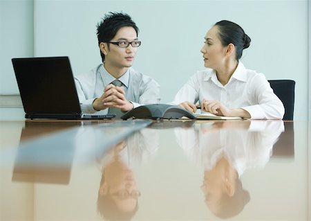 simsearch:6113-06753440,k - Business executives working in conference room Stock Photo - Premium Royalty-Free, Code: 632-01272022