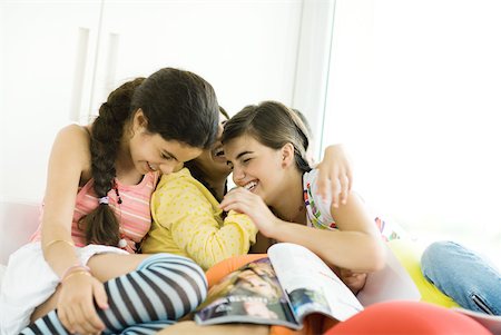 simsearch:695-03388794,k - Three young female friends laughing Stock Photo - Premium Royalty-Free, Code: 632-01380422