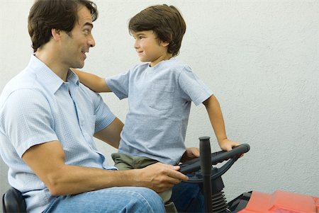 simsearch:632-03848361,k - Father and son on riding lawnmower together Stock Photo - Premium Royalty-Free, Code: 632-01380679