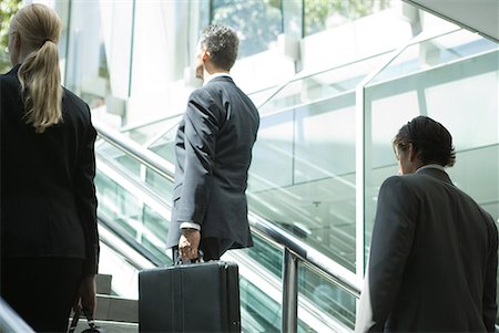 simsearch:632-05401320,k - Business associates walking up stairs, rear view Stock Photo - Premium Royalty-Free, Code: 632-01612079