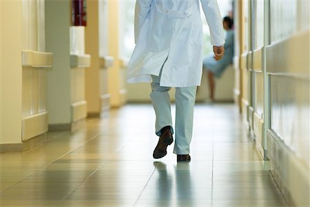 simsearch:632-01613036,k - Male doctor walking in hospital corridor, cropped rear view Stock Photo - Premium Royalty-Free, Code: 632-01613036