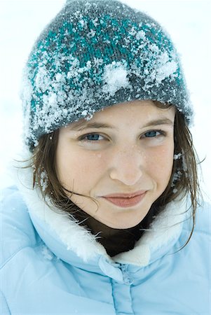 Teenage girl wearing winter clothes in snow, close-up, portrait Stock Photo - Premium Royalty-Free, Code: 632-01613094