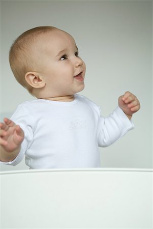 simsearch:632-03027302,k - Baby smiling, looking away, waist up Stock Photo - Premium Royalty-Free, Code: 632-01613257