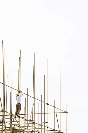 exposed beam ceiling - Construction worker working at construction site Stock Photo - Premium Royalty-Free, Code: 632-01784608