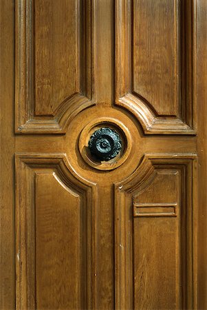 door handle - Wooden door with ornate knob, cropped view Stock Photo - Premium Royalty-Free, Code: 632-01827841