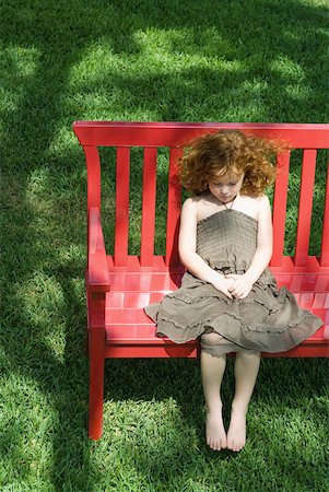 Girl sitting on red bench, high angle view Stock Photo - Premium Royalty-Free, Code: 632-01828558
