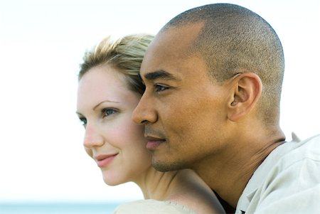 Couple cheek to cheek, looking away together, profile Stock Photo - Premium Royalty-Free, Code: 632-02006917