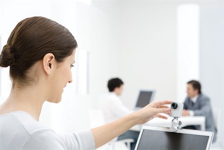 Businesswoman using webcam in office Stock Photo - Premium Royalty-Free, Code: 632-02008148