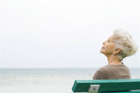 Senior woman sitting near sea, looking at view Stock Photo - Premium Royalty-Free, Code: 632-02038788