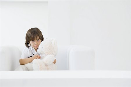 simsearch:695-05768235,k - Little boy playing doctor with teddy bear, using stethoscope Stock Photo - Premium Royalty-Free, Code: 632-02227616
