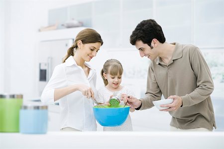 simsearch:632-01193783,k - Little girl helping parents cook in kitchen Stock Photo - Premium Royalty-Free, Code: 632-02282944