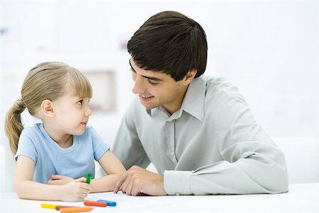 simsearch:632-01193783,k - Father and daughter sitting together at table, girl coloring with crayons Stock Photo - Premium Royalty-Free, Code: 632-02282992