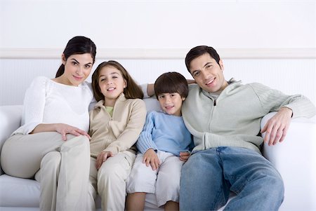 simsearch:695-05769087,k - Family with two children sitting together on sofa, portrait Stock Photo - Premium Royalty-Free, Code: 632-02345178