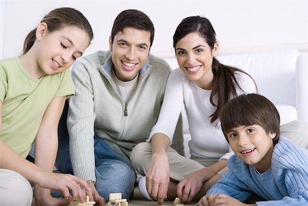 simsearch:695-03378605,k - Family playing dominoes together, smiling Stock Photo - Premium Royalty-Free, Code: 632-02345190