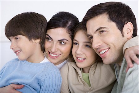 simsearch:695-05769087,k - Parents and two children embracing, cheek to cheek, close-up Stock Photo - Premium Royalty-Free, Code: 632-02345211