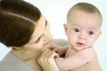 simsearch:632-03027302,k - Mother holding infant, baby looking away Stock Photo - Premium Royalty-Free, Code: 632-02416253
